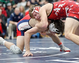 Austintown Fitch's Gus Sutton and Beaver Local's Jared Wright at the EOWL wrestling finals at Austintown Fitch High School on Saturday afternoon. EMILY MATTHEWS | THE VINDICATOR