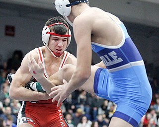 Beaver Local's Skyler Lasure and Louisville's Daniel Kennedy at the EOWL wrestling finals at Austintown Fitch High School on Saturday afternoon. EMILY MATTHEWS | THE VINDICATOR