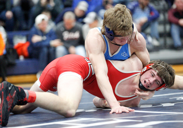 Louisville's Jax Leonard and Beaver Local's Logan Krulik at the EOWL wrestling finals at Austintown Fitch High School on Saturday afternoon. EMILY MATTHEWS | THE VINDICATOR