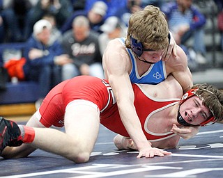 Louisville's Jax Leonard and Beaver Local's Logan Krulik at the EOWL wrestling finals at Austintown Fitch High School on Saturday afternoon. EMILY MATTHEWS | THE VINDICATOR