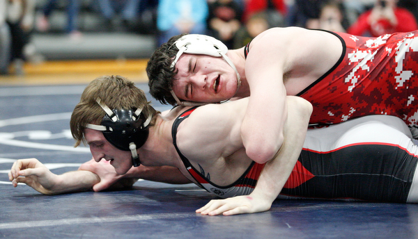 Beaver Local's Brenden Severs and Canfield's David Reinhart at the EOWL wrestling finals at Austintown Fitch High School on Saturday afternoon. EMILY MATTHEWS | THE VINDICATOR