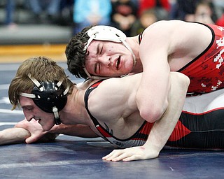 Beaver Local's Brenden Severs and Canfield's David Reinhart at the EOWL wrestling finals at Austintown Fitch High School on Saturday afternoon. EMILY MATTHEWS | THE VINDICATOR