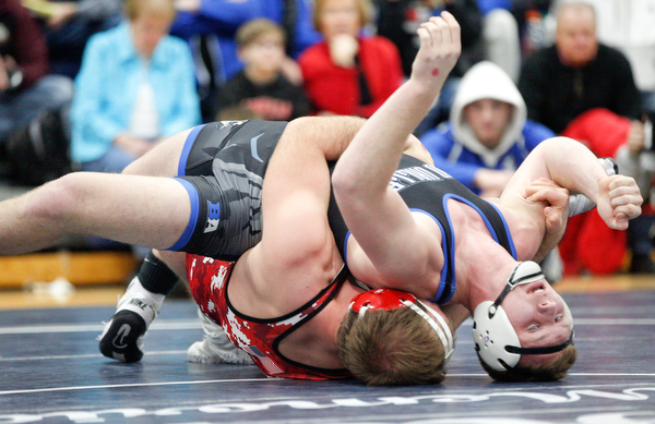 Grand Valley's Clayton Takacs and Beaver Local's Brenden Severs at the EOWL wrestling finals at Austintown Fitch High School on Saturday afternoon. EMILY MATTHEWS | THE VINDICATOR