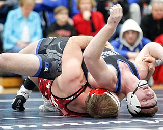 Grand Valley's Clayton Takacs and Beaver Local's Brenden Severs at the EOWL wrestling finals at Austintown Fitch High School on Saturday afternoon. EMILY MATTHEWS | THE VINDICATOR