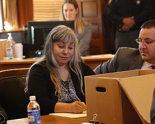 Claudia Hoerig came into the courtroom this morning dressed in civilian clothes and took her seat at the defense table. Beside her is lead defense attorney, John Cornely.