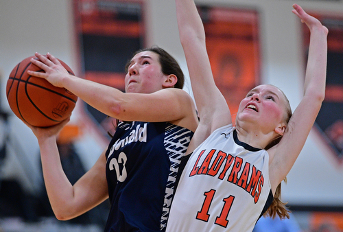 MINERAL RIDGE, OHIO - JANUARY 2019: McDonald's Sophia Costantino drives on Mineral Ridge's Lizzy Panic during the second half of their game, Monday night at Mineral Ridge High School. McDonald won 46-18. DAVID DERMER | THE VINDICATOR