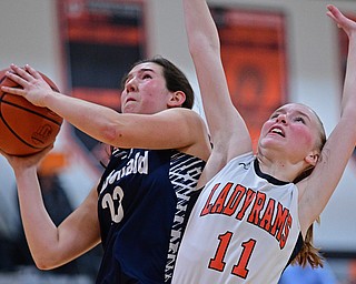 MINERAL RIDGE, OHIO - JANUARY 2019: McDonald's Sophia Costantino drives on Mineral Ridge's Lizzy Panic during the second half of their game, Monday night at Mineral Ridge High School. McDonald won 46-18. DAVID DERMER | THE VINDICATOR