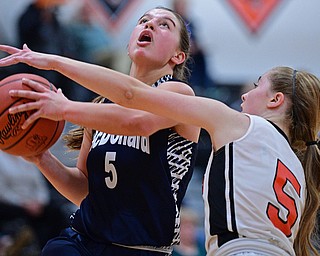 MINERAL RIDGE, OHIO - JANUARY 2019: McDonald's Lucy Wolford goes to the basket against Mineral Ridge's Danielle Aulet during the second half of their game, Monday night at Mineral Ridge High School. McDonald won 46-18. DAVID DERMER | THE VINDICATOR