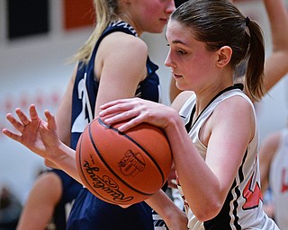 MINERAL RIDGE, OHIO - JANUARY 2019: Mineral Ridge's Fran Kesner dribbles with the ball after taking it away from McDonald's Maddy Howard during the second half of their game, Monday night at Mineral Ridge High School. McDonald won 46-18. DAVID DERMER | THE VINDICATOR