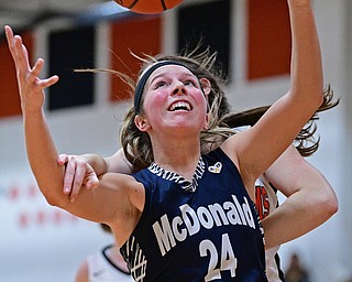 MINERAL RIDGE, OHIO - JANUARY 2019: McDonald's Brooke Lewis grabs a rebound while being pulled by Mineral Ridge's Riley Ladd during the second half of their game, Monday night at Mineral Ridge High School. McDonald won 46-18. DAVID DERMER | THE VINDICATOR