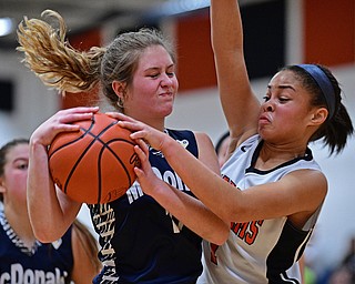 MINERAL RIDGE, OHIO - JANUARY 2019: McDonald's Carley Stitt goes to the basket while being pressured by Mineral Ridge's Candice Miller during the second half of their game, Monday night at Mineral Ridge High School. McDonald won 46-18. DAVID DERMER | THE VINDICATOR