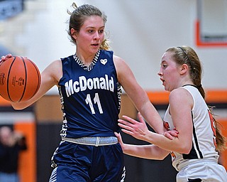 MINERAL RIDGE, OHIO - JANUARY 2019: McDonald's Carley Stitt drives on Mineral Ridge's Danielle Aulet during the second half of their game, Monday night at Mineral Ridge High School. McDonald won 46-18. DAVID DERMER | THE VINDICATOR