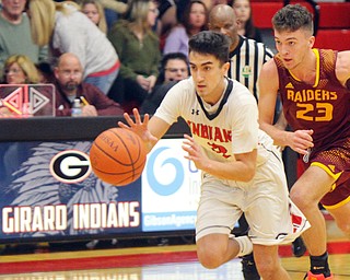 William D. Lewis The Vindicator Girard's Austin Claussell(2) grabs a loose ball while Range's Jaxon Anderson(23) chases during 1-15-19 action in Girard.
