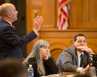 Defense attorney David Rouzzo, left, tries to object something in Trumbull County prosecutor Dennis Watkins' opening statement while Claudia Hoerig and Defense attorney John Cornely sit next to him during Hoerig's trial on Wednesday. EMILY MATTHEWS | THE VINDICATOR