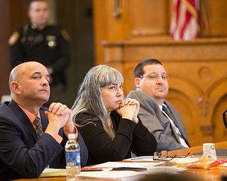 From left, Defense attorney David Rouzzo, Claudia Hoerig and Defense attorney John Cornely listen to Trumbull County prosecutor Dennis Watkins' opening statement during Hoerig's trial on Wednesday. EMILY MATTHEWS | THE VINDICATOR