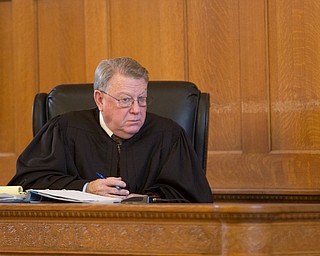 Judge Andrew Logan listens to Trumbull County prosecutor Dennis Watkins' opening statement during Claudia Hoerig's trial on Wednesday. EMILY MATTHEWS | THE VINDICATOR
