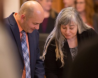 Defense attorney David Rouzzo and Claudia Hoerig talk during her trial on Wednesday. EMILY MATTHEWS | THE VINDICATOR