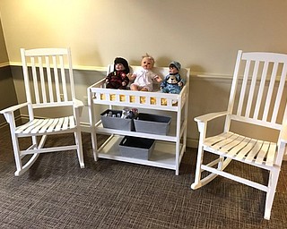 Neighbors | Submitted.Rocking chairs, dolls and other items used at the new memory care facility, Journeys, at the Inn at Walker Mill were brought to the third floor of the building and made available to residents.