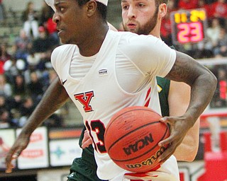 William D. Lewis The Vindicator YSU's Donel CathcartIII (13) drives oast WSU's Alan Vest(4) during1-17-19 action at YSU.