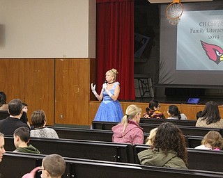 Neighbors | Abby Slanker.Canfield Local School District Literacy Coach Carol Young, in keeping with the story book theme, dressed as Cinderella and addressed parents and students at C.H. Campbell Elementary School’s family literacy night on Jan. 8.