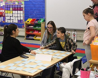 Neighbors | Abby Slanker.C.H. Campbell Elementary School kindergartners played a rhyming matching game in their classroom during the school’s family literacy night.