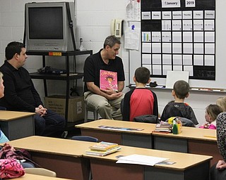 Neighbors | Abby Slanker.C.H. Campbell Elementary School second-grade teacher John DiRenzo discussed a book with his students and their parents in his classroom during the school’s family literacy night on Jan. 8.