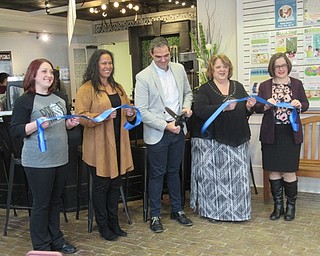 Neighbors | Jessica Harker.Co-owner of Pressed Bar and Eatery, Frank Tuscano, cut the ribbon opening the new location at the Poland library.