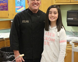 Neighbors | Abby Slanker.Jason Capps of Bella Sera visited the seventh-grade Canfield Village Middle School expressive arts food class to demonstrate how to make a pasta dish on Dec. 4. Capp’s daughter, Lauren, invited her dad to the class.