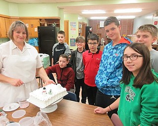 Neighbors | Submitted.Sue Runion of Nemenz IGA demonstrated cookie and cake decorating for the sixth-grade expressive arts food class at Canfield Village Middle School on Dec. 4.