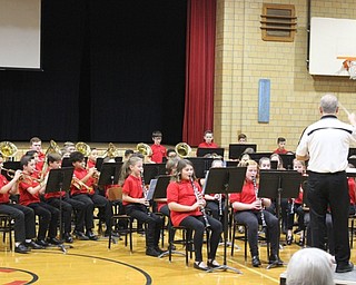 Neighbors | Abby Slanker.Canfield Village Middle School Band Director James Volenik conducted the fifth-grade band during the school’s annual holiday concert on Dec. 11.