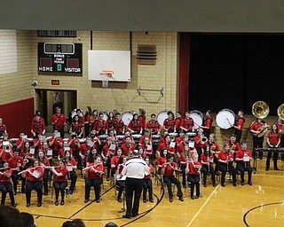 Neighbors | Abby Slanker.On Dec. 11, the Canfield High School symphonic band and marching band drum line, under the direction of CHS Band Director Mike Kelly, joined the Canfield Village Middle School fifth-grade band at the school’s annual holiday concert.
