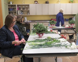 Neighbors | Jessica Harker.Community members gathered at Fellows Riverside Garden on Dec. 18 to create holiday themed centerpieces.