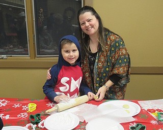Neighbors | Jessica Harker.Damian and Shantell Huertas rolled out cookie dough to bake and decorate for Santa on Dec. 19 at Boardman Park's Cookies with Santa event.