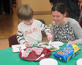 Neighbors | Jessica Harker.James and Julie Toth decorated cookies on Dec. 19 at the Boardman Park's Cookies with Santa event.