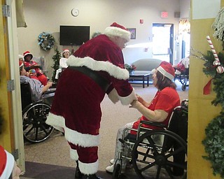 Neighbors | Jessica Harker.Santa Claus traveled to Beeghly Oaks to meet with residents as they celebrated their annual Christmas party on Dec. 19.