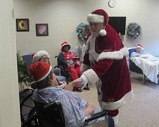 Neighbors | Jessica Harker.Beeghly Oaks residents were greeted by Santa Claus and posed for photos with him on Dec. 19 during the annual holiday party.