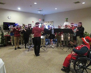 Neighbors | Jessica Harker.Members of Boardman High School's wind ensemble performed for the residents of Beeghly Oaks at their annual holiday party.