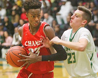 William D. Lewis The Vindicator  Chaney's Wiliam Brown(23) and Ursuline's Johnny Rowland(23) during 1-18-19 action at Ursuline.