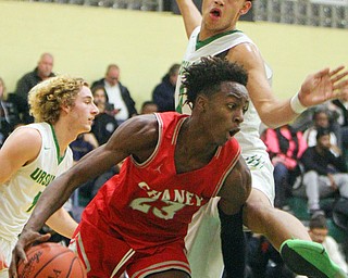 William D. Lewis The Vindicator  Chaney's (23) eludes Ursuline's (0) ..during 1-18-19 action at Ursuline.