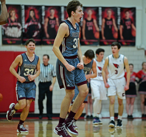 CANFIELD, OHIO - JANUARY 18, 2019: Boardman's Ethan Anderson celebrates after hitting a three point shot to beat the buzzer at the end of the first half of their game, Friday night at Canfield High School. DAVID DERMER | THE VINDICATOR..Boardman's Marco Stilliana, Canfield's Brayden Beck pictured.