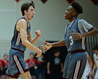 CANFIELD, OHIO - JANUARY 18, 2019: Boardman's Ethan Anderson, left, is congratulated by Derrick Anderson after hitting a three point shot to beat the buzzer at the end of the first half of their game, Friday night at Canfield High School. DAVID DERMER | THE VINDICATOR.