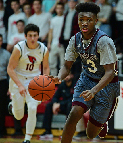 CANFIELD, OHIO - JANUARY 18, 2019: Boardman's Derrick Anderson goes to the basket while being chased by Canfield's Conor Crogan during the second half of their game, Friday night at Canfield High School. DAVID DERMER | THE VINDICATOR