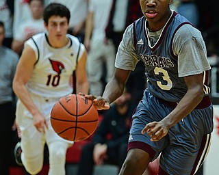 CANFIELD, OHIO - JANUARY 18, 2019: Boardman's Derrick Anderson goes to the basket while being chased by Canfield's Conor Crogan during the second half of their game, Friday night at Canfield High School. DAVID DERMER | THE VINDICATOR