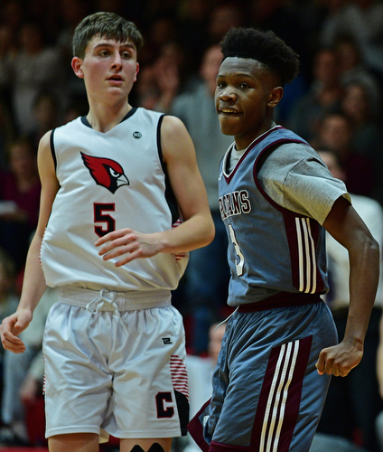 CANFIELD, OHIO - JANUARY 18, 2019: Boardman's Derrick Anderson, right, celebrates after making a basket and being fouled while Canfield's Joe Bruno watches during the second half of their game, Friday night at Canfield High School. DAVID DERMER | THE VINDICATOR