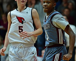 CANFIELD, OHIO - JANUARY 18, 2019: Boardman's Derrick Anderson, right, celebrates after making a basket and being fouled while Canfield's Joe Bruno watches during the second half of their game, Friday night at Canfield High School. DAVID DERMER | THE VINDICATOR