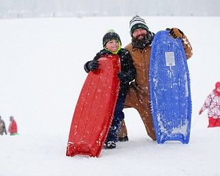 Rocco DelBene, right, and Rocco DelBene Jr., 6, both of Girard, pose with their sleds while sled riding at Wick Recreation Area on Saturday afternoon. EMILY MATTHEWS | THE VINDICATOR