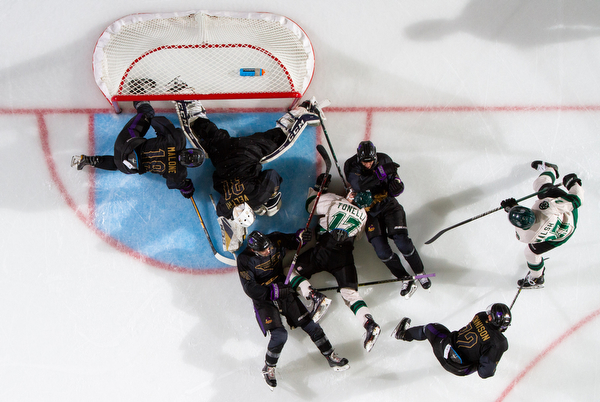 Scott R. Galvin | The Vindicator.Youngstown Phantoms goalie Chad Veltri (31) makes a save as players from the Phantoms and Cedar Rapids RoughRiders fall around him in front of the net during the second period at the Covelli Centre on Saturday, January 19, 2019.  The Phantoms lost 4-2.