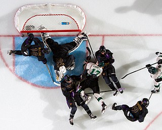 Scott R. Galvin | The Vindicator.Youngstown Phantoms goalie Chad Veltri (31) makes a save as players from the Phantoms and Cedar Rapids RoughRiders fall around him in front of the net during the second period at the Covelli Centre on Saturday, January 19, 2019.  The Phantoms lost 4-2.