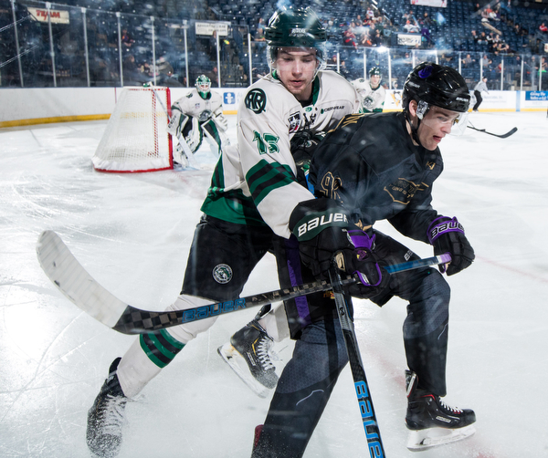 Scott R. Galvin | The Vindicator.Youngstown Phantoms forward Liam Robertson (92) skates into the corner along with Cedar Rapids RoughRiders defenseman Jack Millar (15) for the puck during the third period at the Covelli Centre on Saturday, January 19, 2019.  The Phantoms lost 4-2.