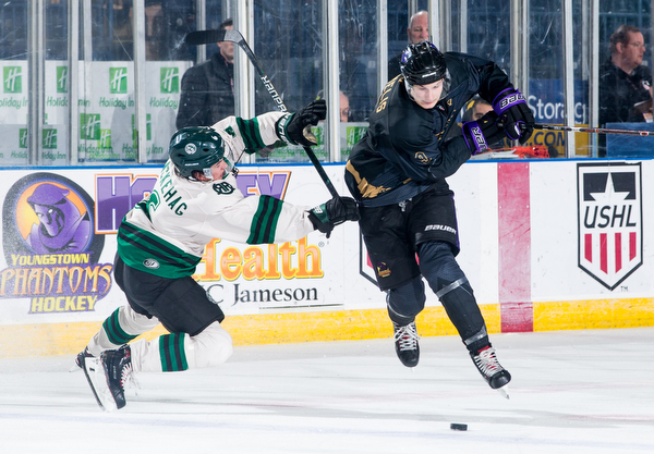 Scott R. Galvin | The Vindicator.Youngstown Phantoms forward Matthew DeMelis (9) skates around Cedar Rapids RoughRiders defenseman Adam Backehag (6) during the third period at the Covelli Centre on Saturday, January 19, 2019.  The Phantoms lost 4-2.
